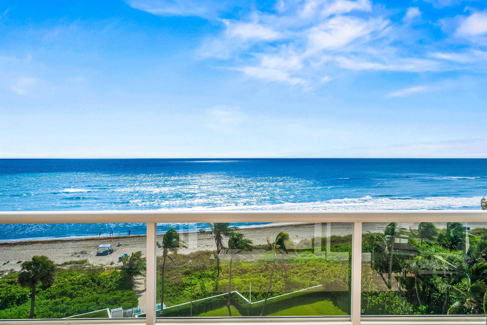 A balcony view overlooking a sandy beach, palm trees, and the blue ocean — 700 S Ocean Boulevard # 705, Boca Raton FL 33432, BOCA RATON, FL