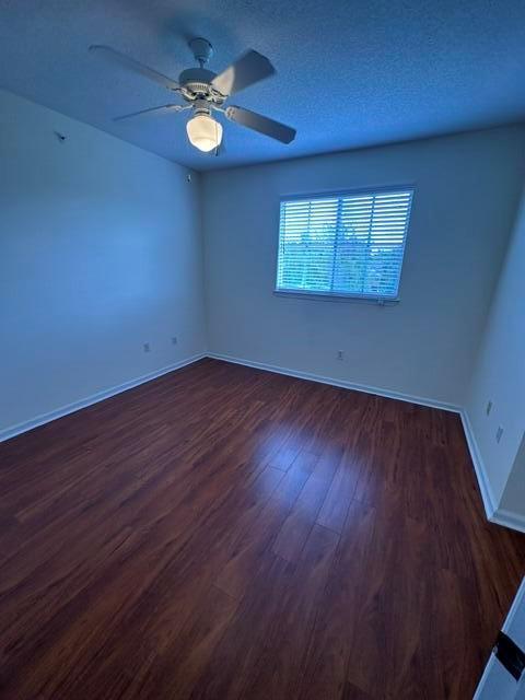 An empty bedroom features wood-look flooring, light-colored walls, and a ceiling fan — 2036 Alta Meadows Lane # 1403, Delray Beach FL 33444, DELRAY BEACH, FL