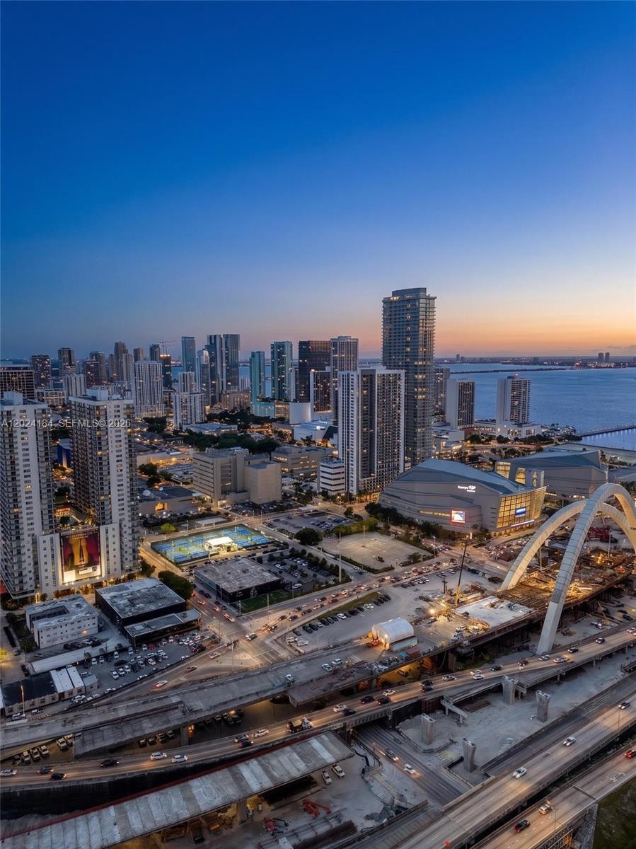 An aerial view of the Miami skyline at dusk featuring the Kaseya Center and bridge — 20 NE 11 St # 2601, Miami FL 33132, MIAMI, FL