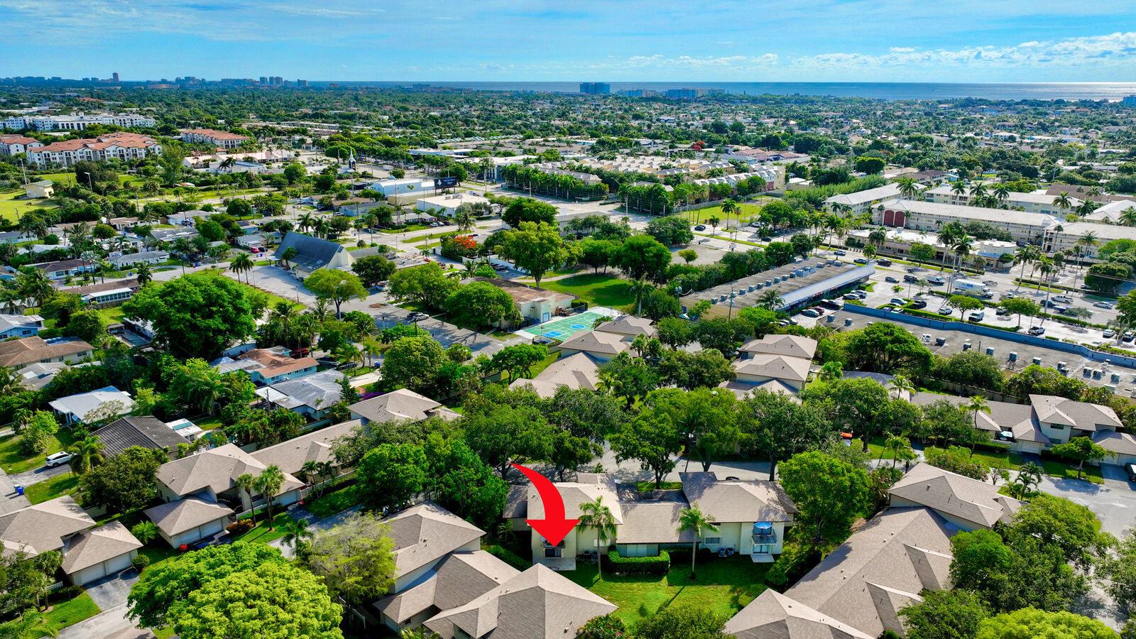 An aerial view of a residential neighborhood with a red arrow pointing to a townhouse — 3951 NE 19th Road # 1701, Pompano Beach FL 33064, POMPANO BEACH, FL