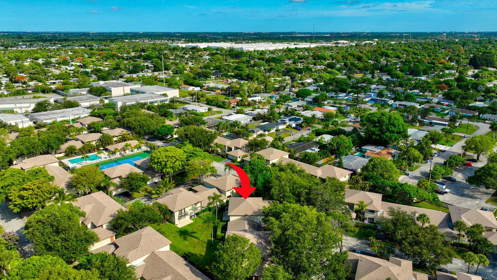 An aerial view of a residential neighborhood with a red arrow pointing to a house — 3951 NE 19th Road # 1701, Pompano Beach FL 33064, POMPANO BEACH, FL