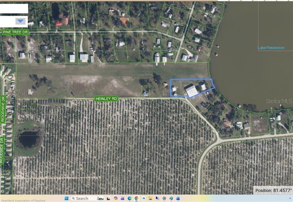 An aerial map view shows a property with buildings located along the shore of a lake — 115 HEINLEY ROAD, LAKE PLACID, FL