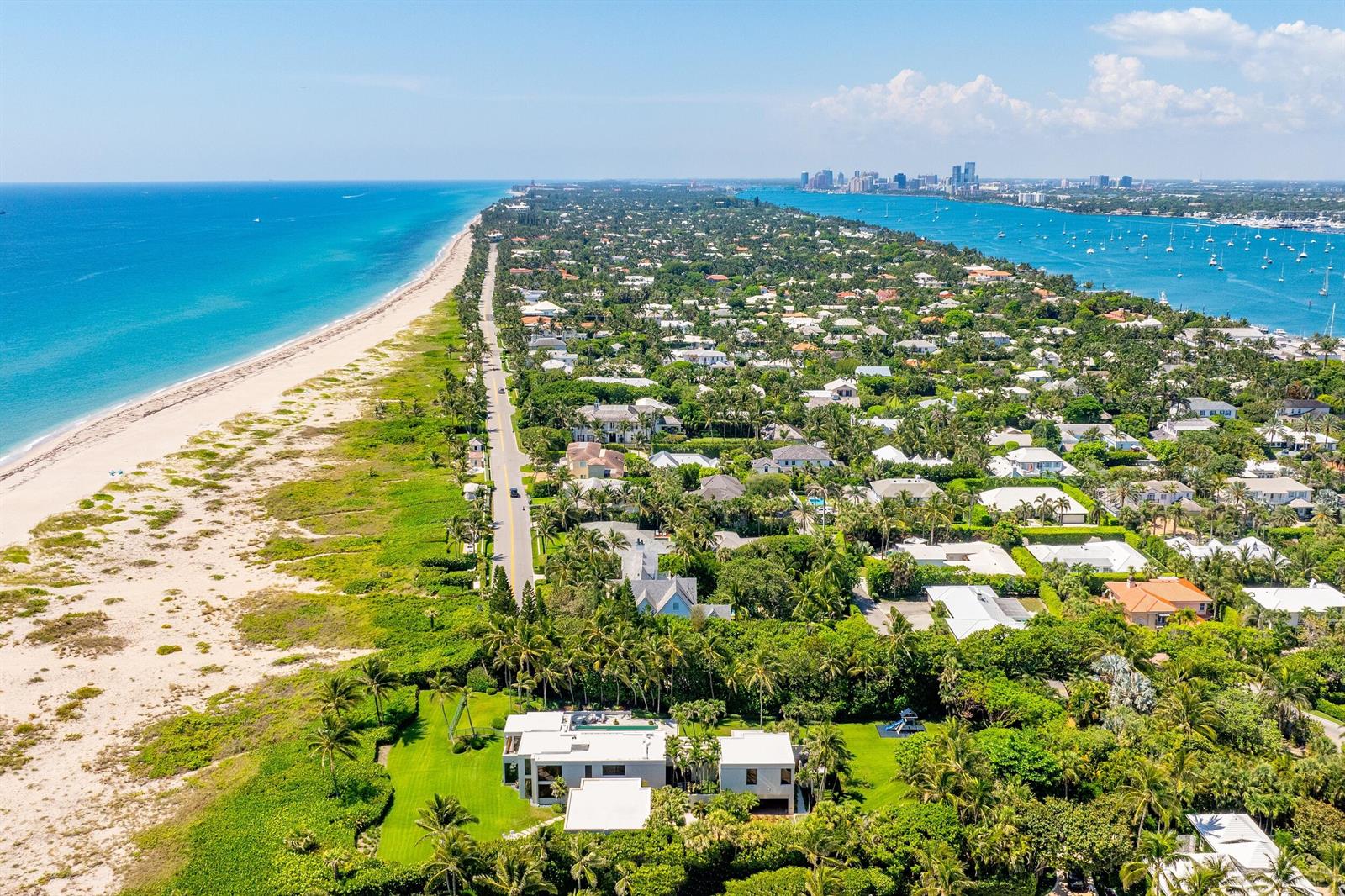 An aerial view of a coastal residential area with a beach, road, and many homes — 1446 N Ocean Boulevard, Palm Beach FL 33480, PALM BEACH, FL