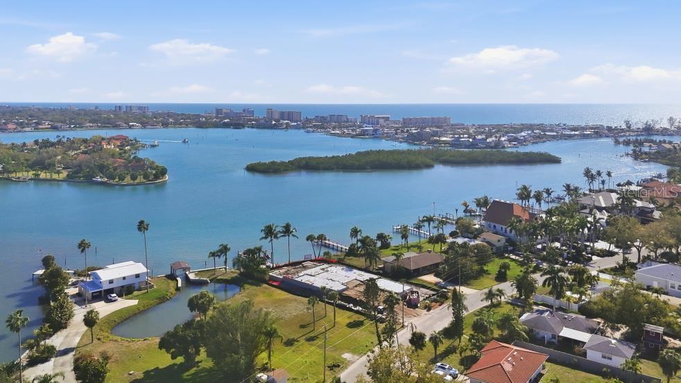 An aerial view shows a waterfront property under construction near a bay and the ocean — 0 BAYVIEW PARKWAY, NOKOMIS, FL