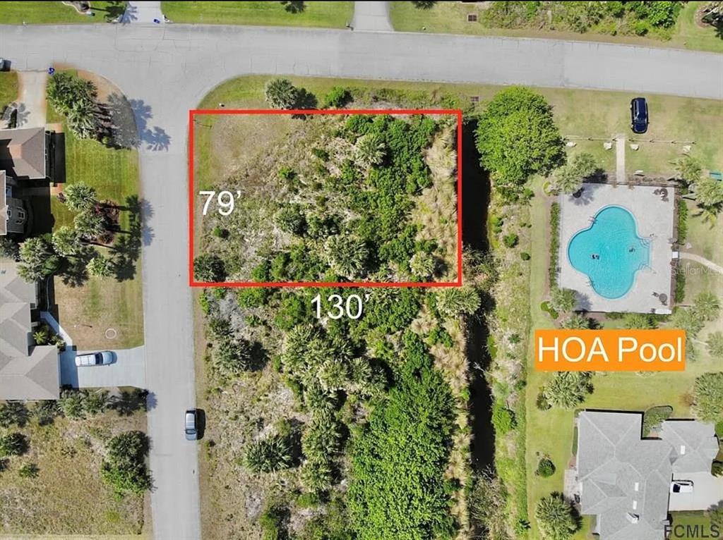 This is an aerial map showing a vacant residential lot next to an HOA pool — 24 MAHOE DRIVE S, PALM COAST, FL