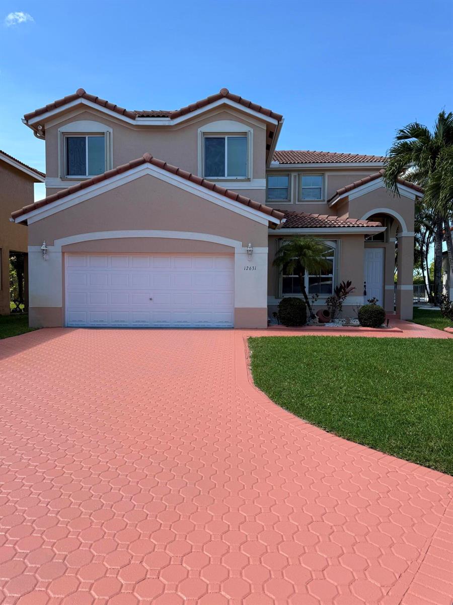 A two-story suburban house with a pink paver driveway and a two-car garage — 12631 SW 28th Street, Miramar FL 33027, MIRAMAR, FL
