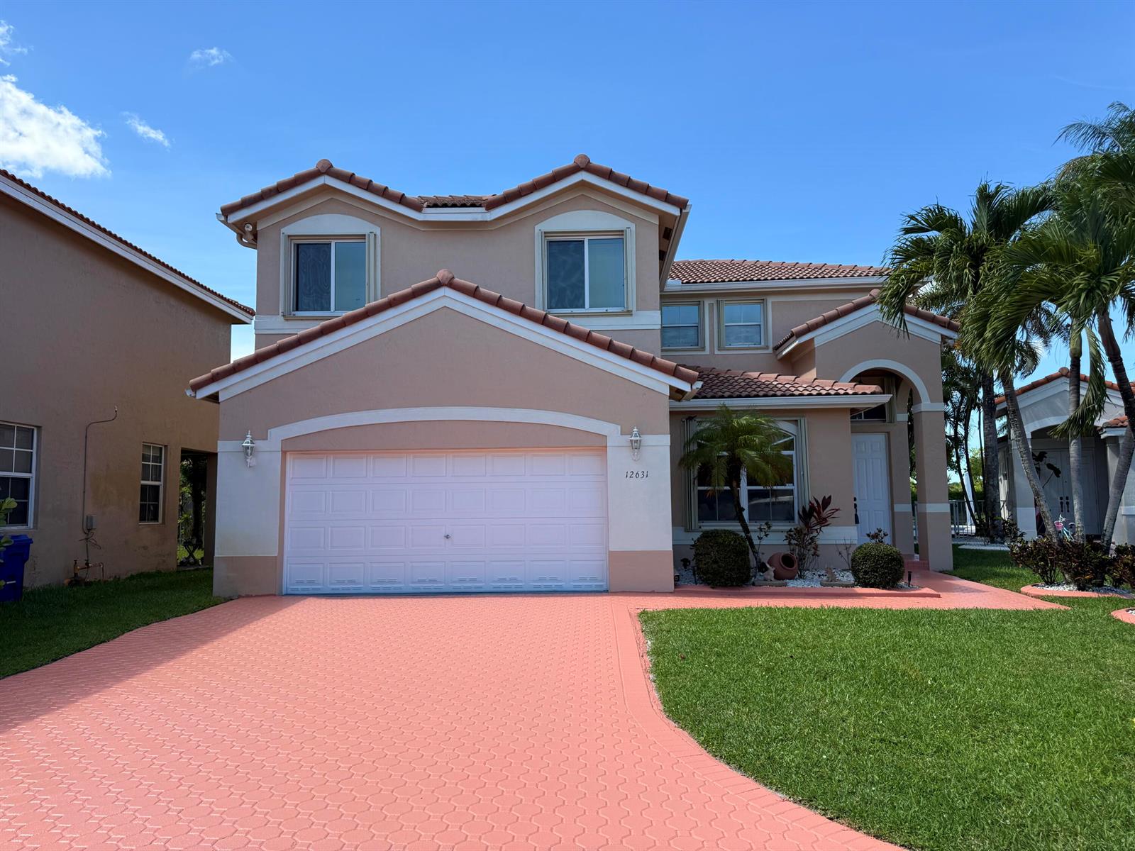 A two-story suburban house with a pink paver driveway, a garage, and a tiled roof — 12631 SW 28th Street, Miramar FL 33027, MIRAMAR, FL