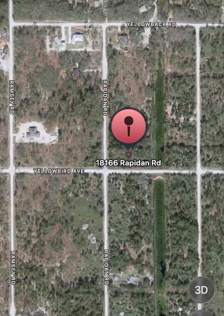 This is an aerial map view showing a vacant lot marked with a red pin — RAPIDAN ROAD, WEEKI WACHEE, FL