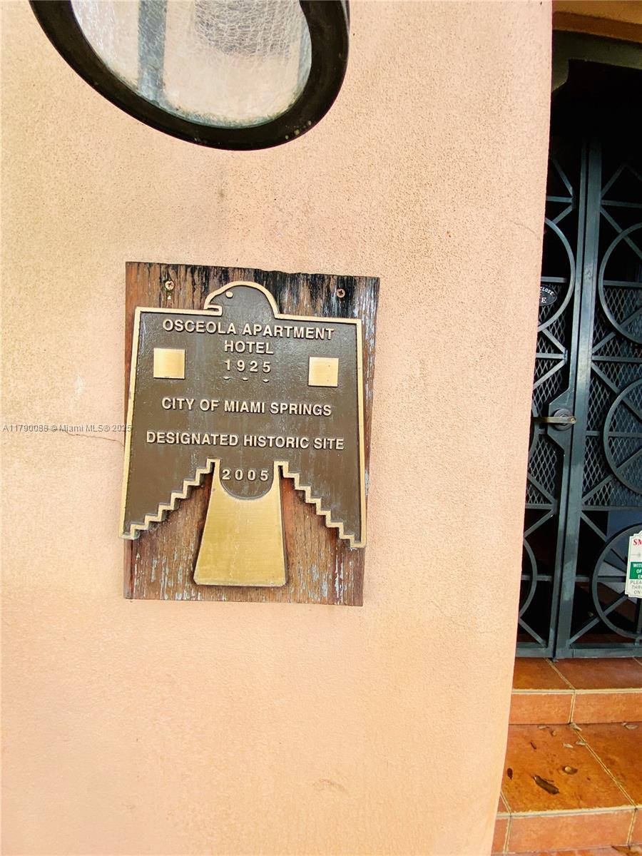 A historic site plaque for the Osceola Apartment Hotel is mounted on a stucco wall — 200 Azure Way, Miami Springs FL 33166, MIAMI SPRINGS, FL
