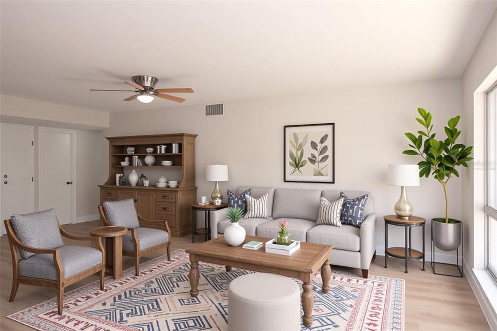 This is a digital rendering of a living room featuring a sofa, armchairs, and hutch — 806 OAKMONT AVENUE, SUN CITY CENTER, FL