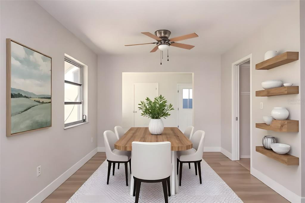 This digital rendering shows a dining room with a wooden table, chairs, and wall shelving — 806 OAKMONT AVENUE, SUN CITY CENTER, FL