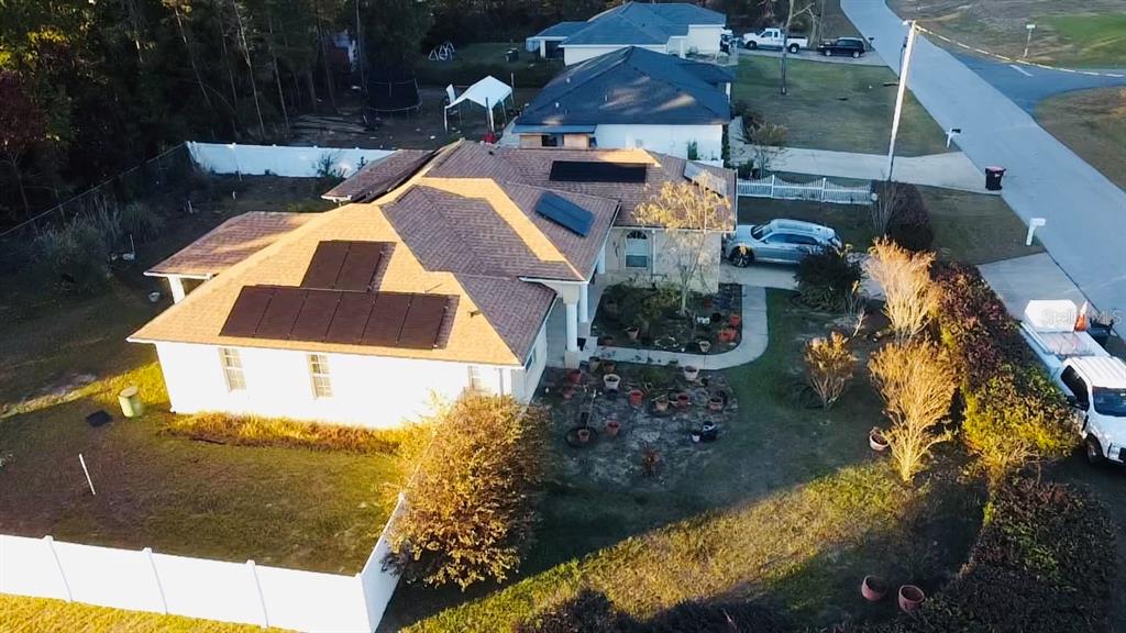 An aerial view of a single-story house with solar panels on the roof — 3715 SW 127TH LANE ROAD, OCALA, FL