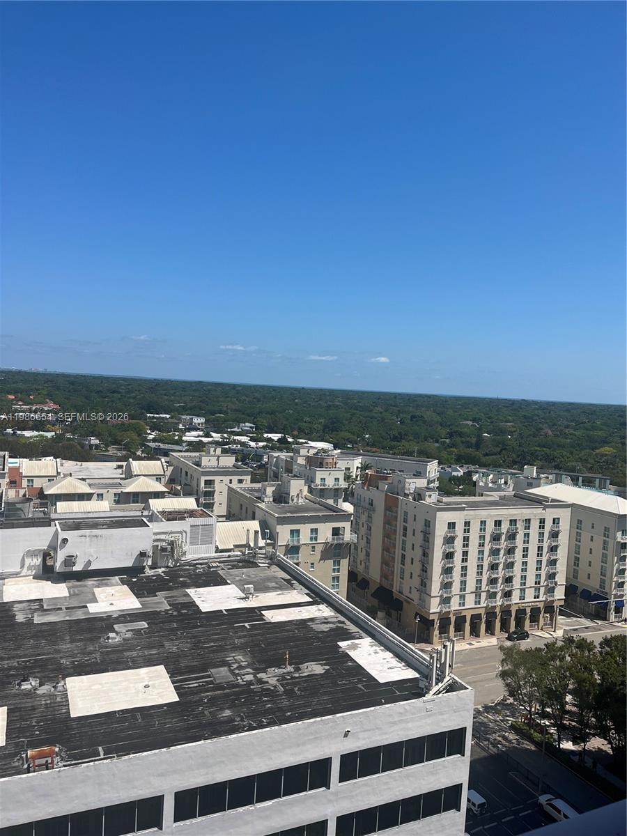 An elevated view of a flat rooftop overlooking a neighborhood with buildings and trees — 7350 SW 89th St # 1801S, Miami FL 33156, MIAMI, FL