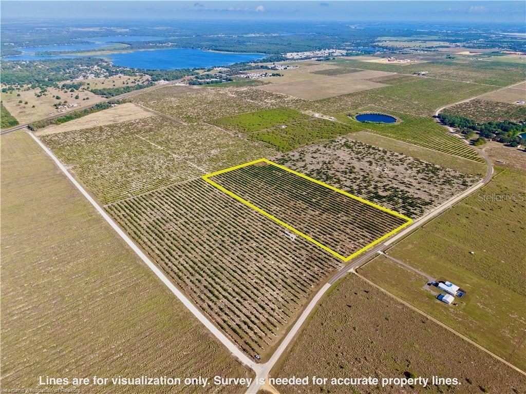 An aerial view shows a rectangular plot of land marked by a yellow boundary line — 8961 COUNTY ROAD 17 S, SEBRING, FL