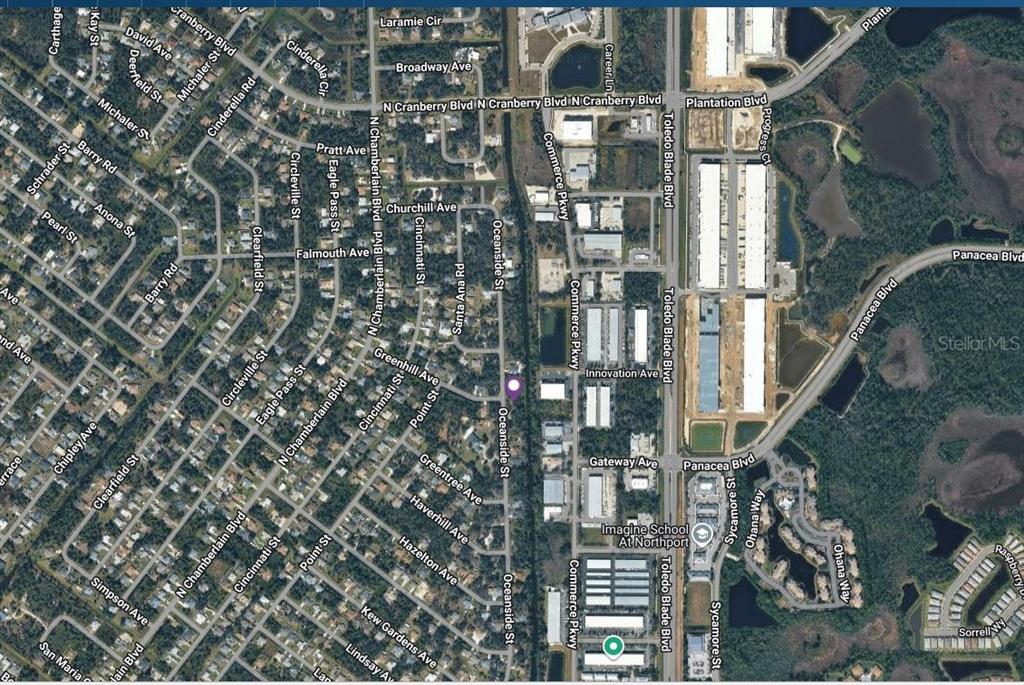 This is an aerial map view of a residential and commercial area in North Port — OCEANSIDE STREET, NORTH PORT, FL
