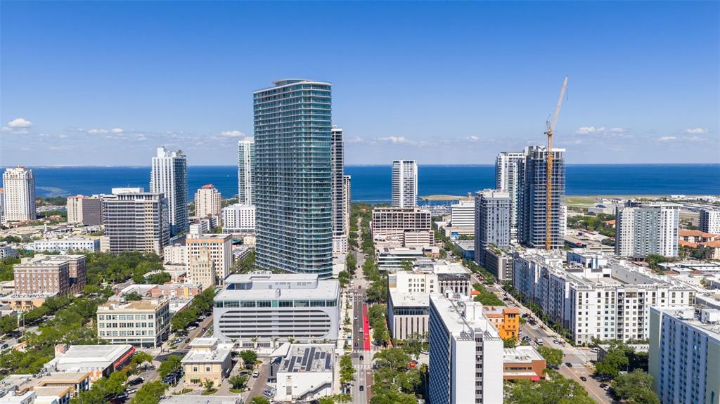An aerial view of a dense city skyline featuring high-rise buildings near a large body of water — 400 CENTRAL AVENUE UNIT 3906, ST PETERSBURG, FL
