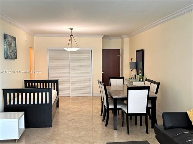 An open-concept living and dining area features tile floors, a daybed, and a dining set — 4001 S Ocean Dr # 9L, Hollywood FL 33019, HOLLYWOOD, FL