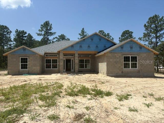 A single-story house under construction with concrete block walls and blue sheathing — 12188 SW 81ST STREET, DUNNELLON, FL