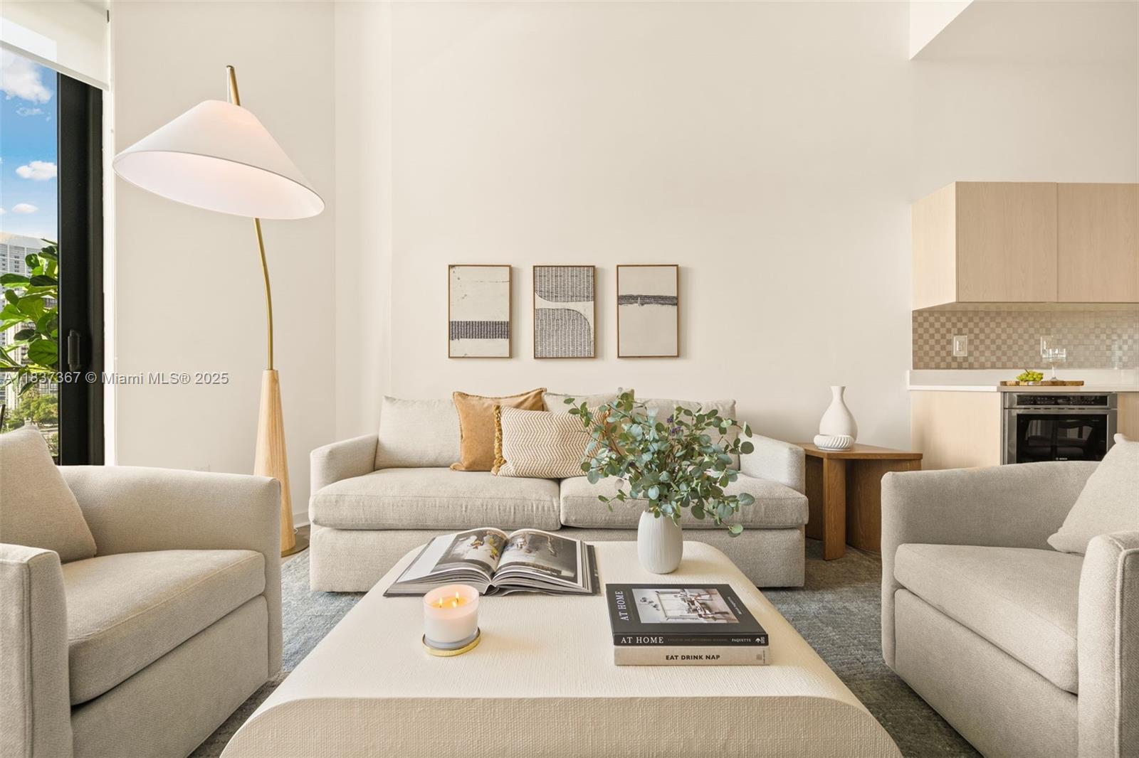 A living room features a sofa, two armchairs, a coffee table, and a floor lamp — 501 NE 31st St # 410, Miami FL 33137, MIAMI, FL