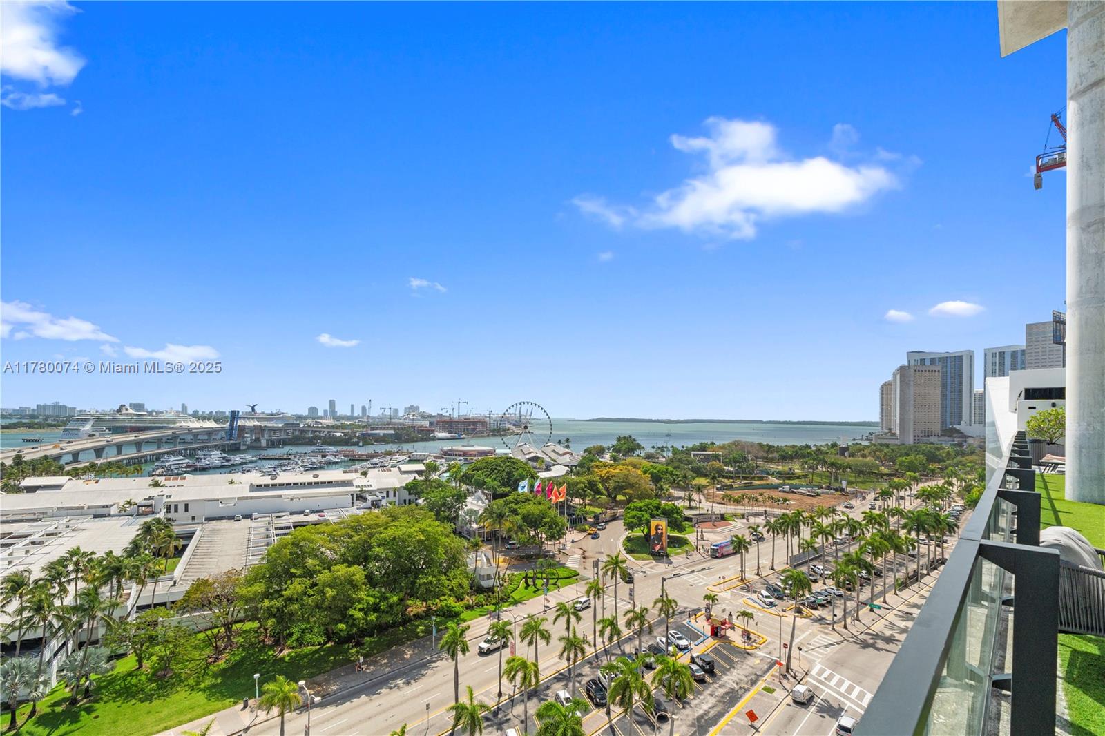 An elevated balcony view overlooks a city park, a Ferris wheel, and the harbor — 398 NE 5th St # 2119, Miami FL 33132, MIAMI, FL