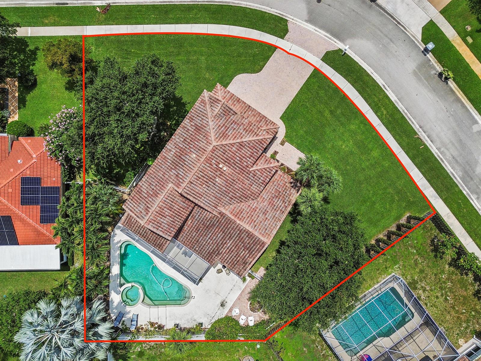 Aerial view of a residential property featuring a house with a pool and large yard — 7461 Anadale Circle, Lake Worth FL 33467, LAKE WORTH, FL