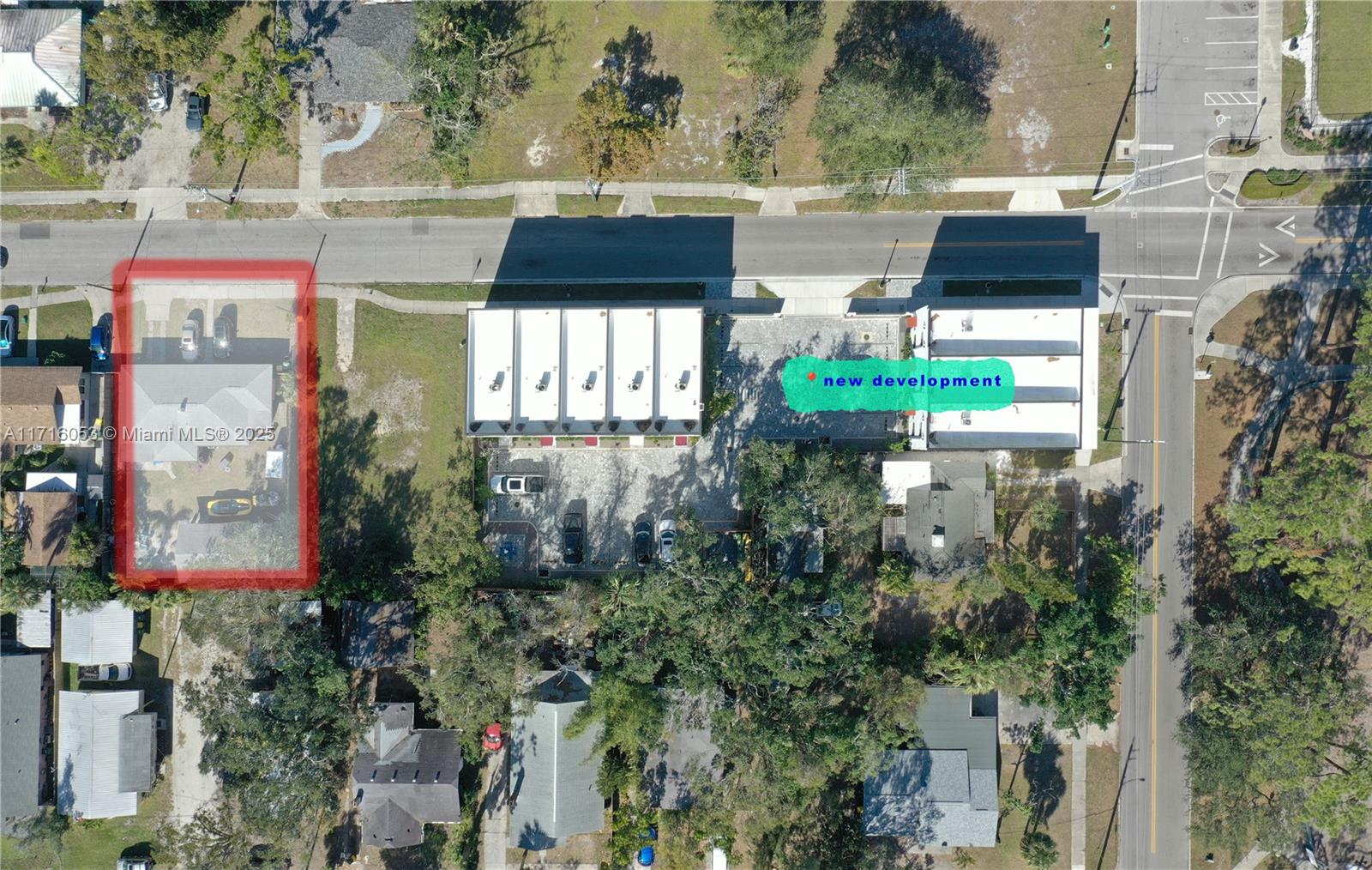 This aerial view shows a residential property outlined in red next to a new development — 1744 10th st, Sarasota FL 34236, SARASOTA, FL