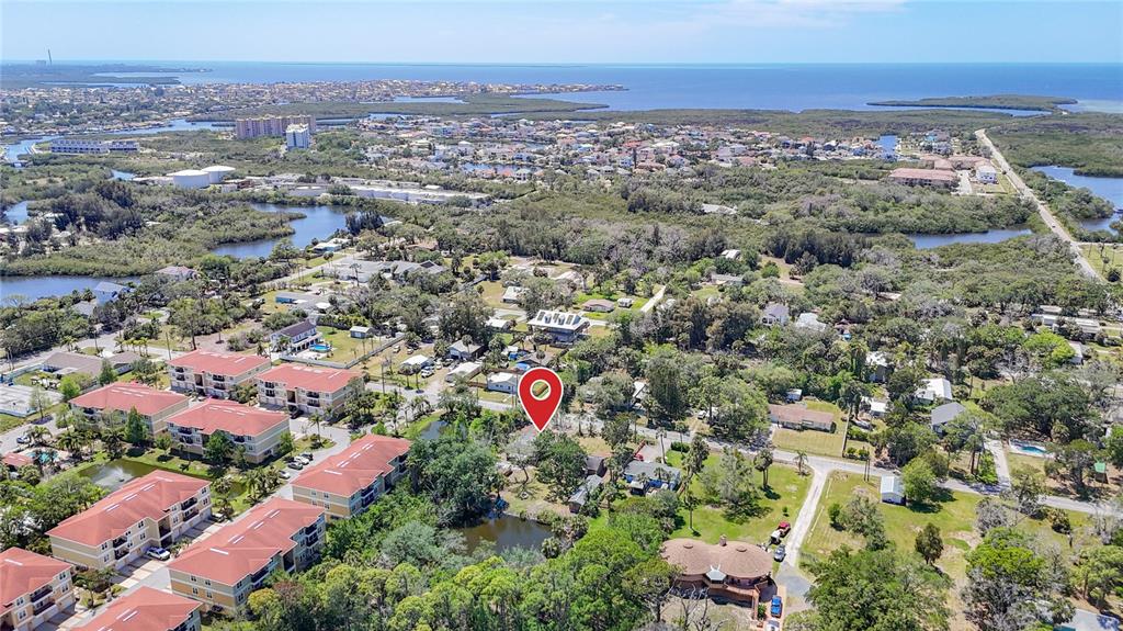 An aerial view shows a residential area with apartment buildings, trees, and a red pin — 6420 & 6426 OELSNER STREET, NEW PORT RICHEY, FL