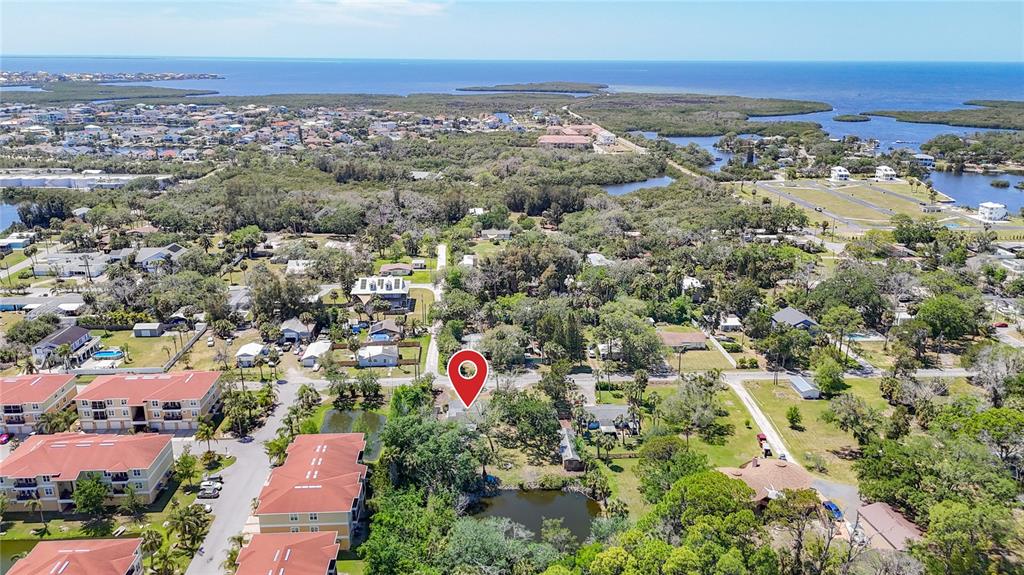 An aerial view shows a residential neighborhood with a red location pin over a property — 6420 & 6426 OELSNER STREET, NEW PORT RICHEY, FL
