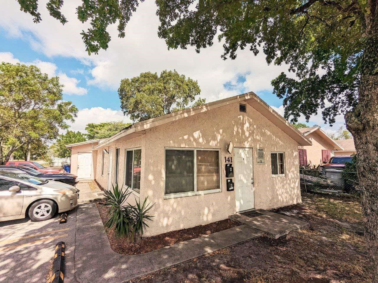 A single-story stucco building with two front doors and a parking area in front — 141 NW 10th Street, Pompano Beach FL 33060, POMPANO BEACH, FL