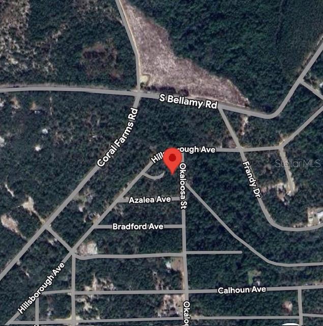 This is an aerial map showing a red location pin at the intersection of local streets — 903 OKALOOSA STREET, FLORAHOME, FL