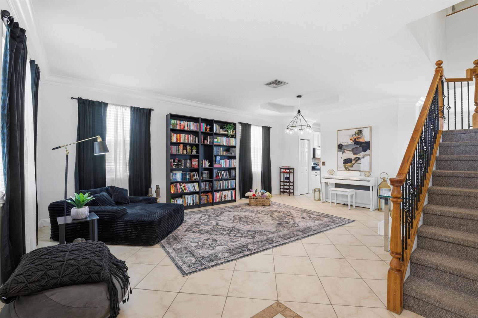 A two-story, peach-colored house with a garage and a manicured hedge in the front yard — 2644 San Andros, West Palm Beach FL 33411, WEST PALM BEACH, FL