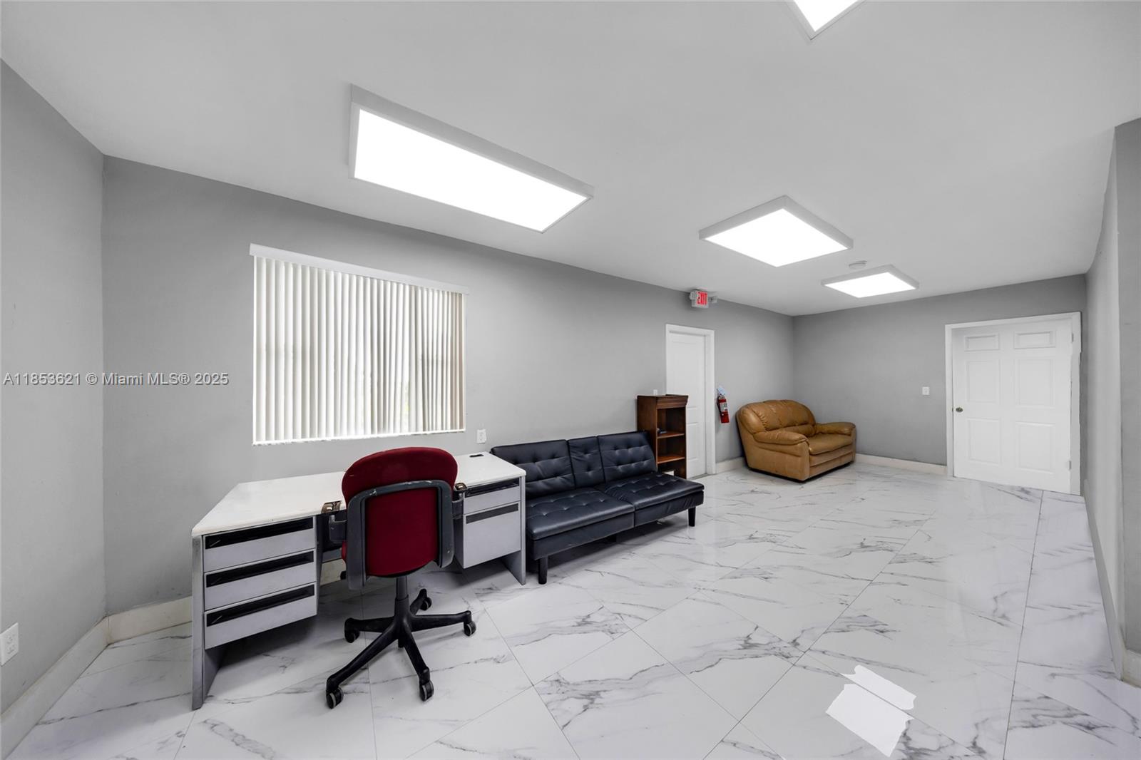 An office room features gray walls, white marble-patterned tile flooring, and three ceiling light panels — 2696 W 3rd Ave, Hialeah FL 33010, HIALEAH, FL