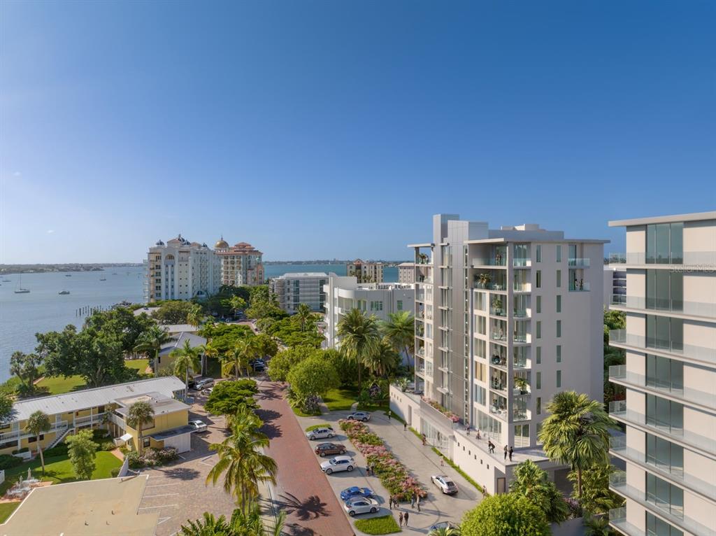 This is a rendering of a modern apartment building exterior near a waterfront — 621 GOLDEN GATE POINT, SARASOTA, FL