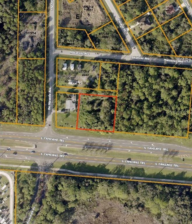 This is an aerial map showing a vacant lot outlined in red near a highway — 11151 TAMIAMI LOTS 43 44 45 & 46 TRAIL S, NORTH PORT, FL