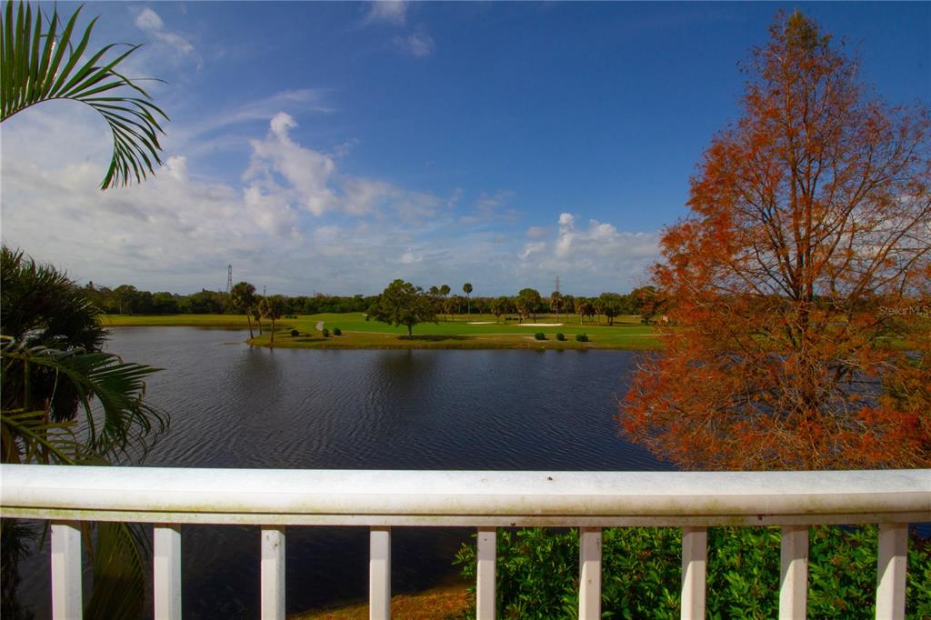 A view from a balcony overlooking a lake and a golf course — 1200 COUNTRY CLUB DRIVE UNIT 1101, LARGO, FL