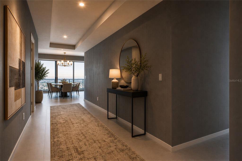 A modern hallway features gray walls, a console table with a mirror, and a dining area — 400 CENTRAL AVENUE UNIT 2601, ST PETERSBURG, FL