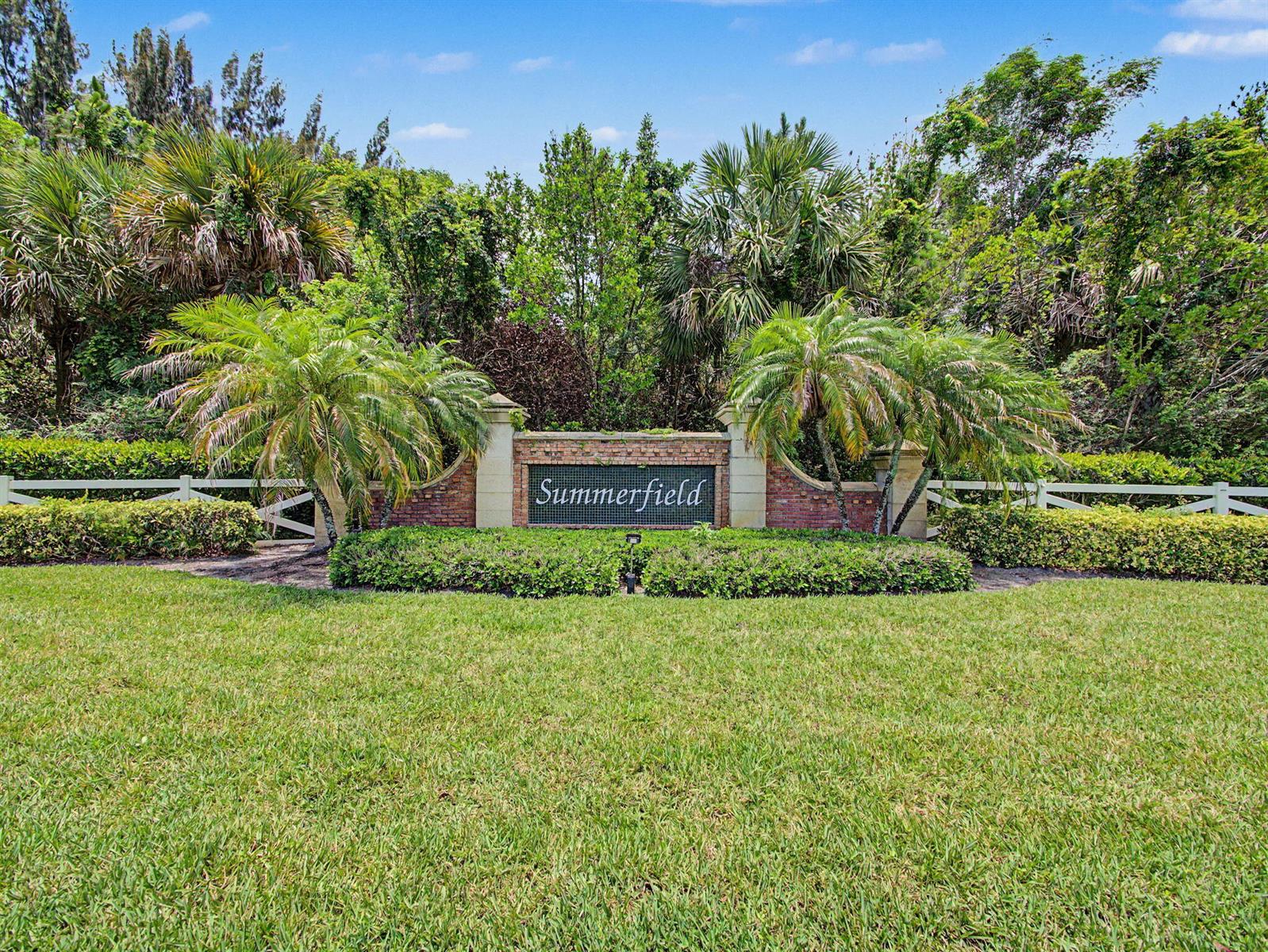 A brick monument sign reading Summerfield stands in front of lush trees and palm trees — 6467 SE Wild Olive Lane, Stuart FL 34997, STUART, FL