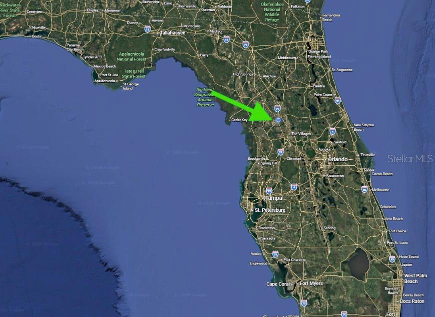 This is a map of Florida with a green arrow pointing toward the central region — TBD NW 12 STREET, OCALA, FL