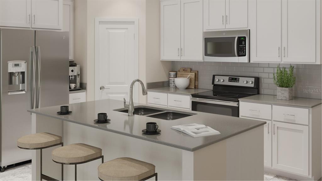 This is a digital rendering of a modern kitchen featuring white cabinets and a gray island — 1631 LOXELY TRAIL, KISSIMMEE, FL