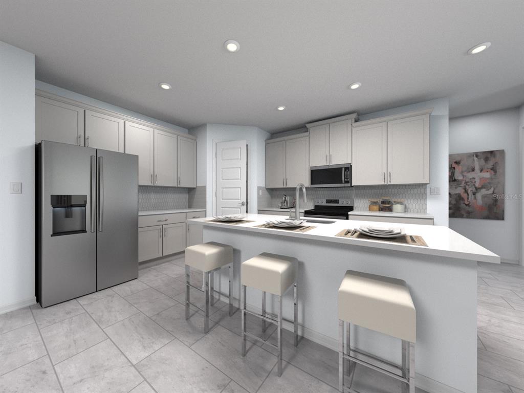 This is a rendering of a modern kitchen featuring white cabinetry, stainless appliances, and an island — 14164 HARVEST PINES LANE, HUDSON, FL