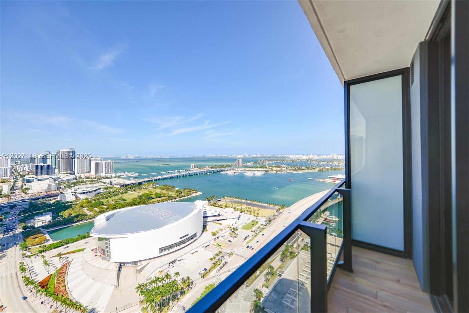 A high-rise balcony overlooks the Kaseya Center and Biscayne Bay in Miami — 398 NE 5th St # 3505, Miami FL 33132, MIAMI, FL