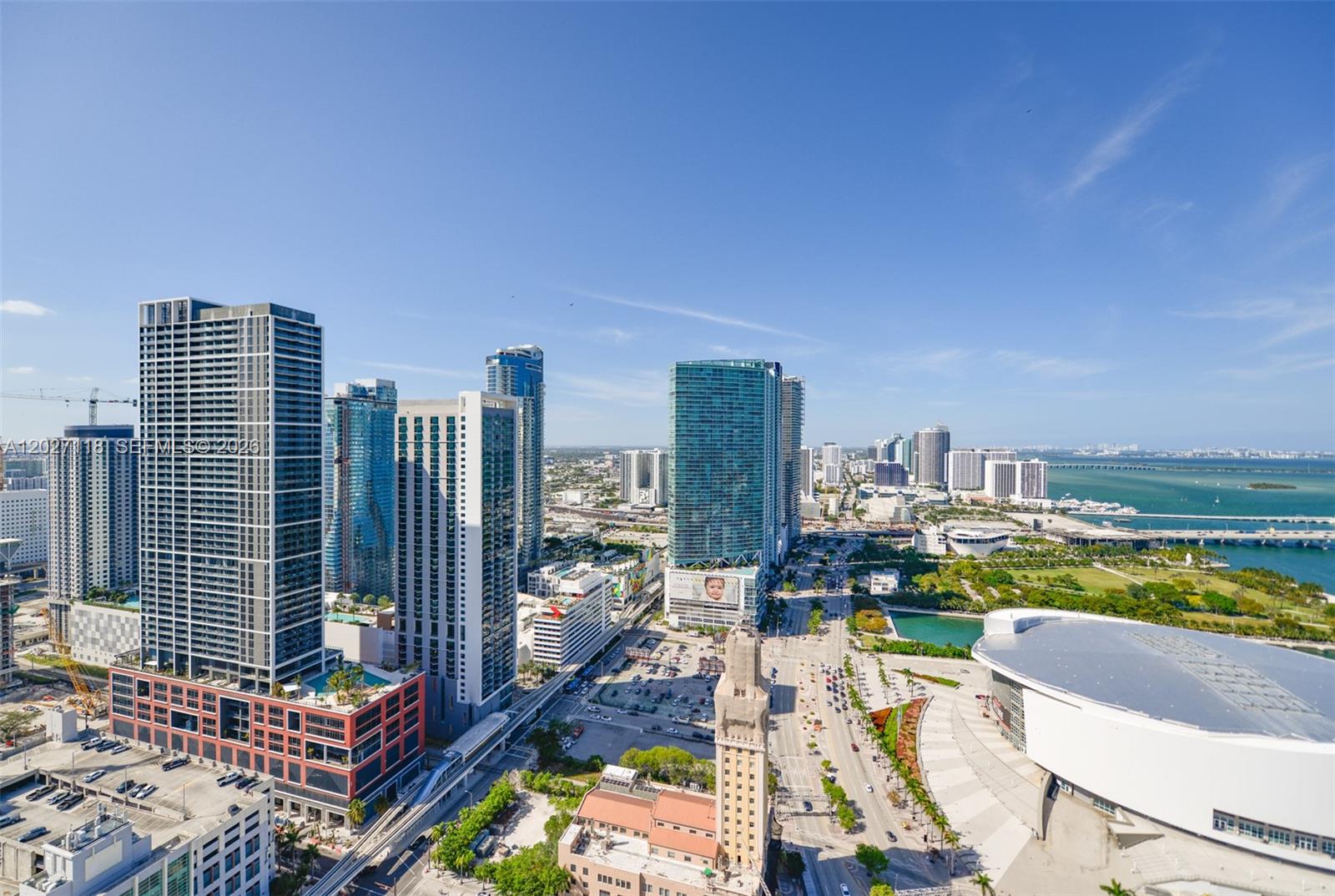 An aerial view of the Miami skyline featuring high-rise buildings, a stadium, and a bay — 398 NE 5th St # 3505, Miami FL 33132, MIAMI, FL