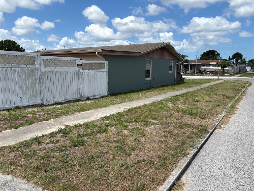 This is a floor plan showing the layout of a single-story house with a garage — 4934 DAPHNE STREET, NEW PORT RICHEY, FL