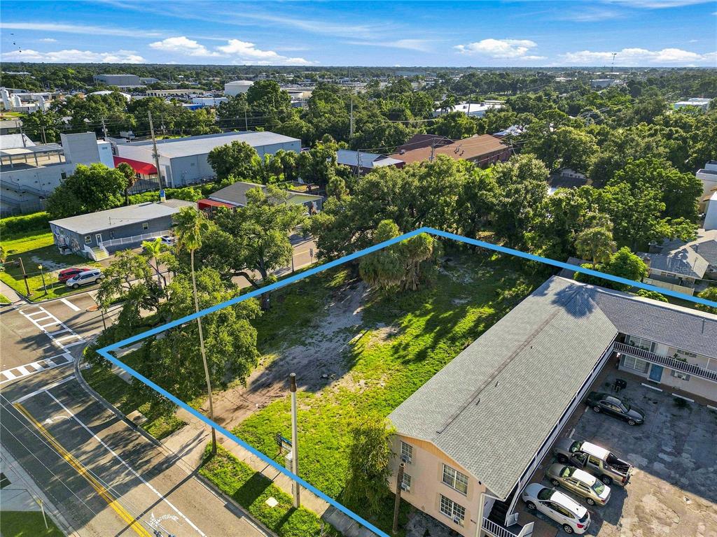 An aerial view shows a rectangular lot with a multi-unit building and mature trees — 918 ORANGE AVENUE, SARASOTA, FL