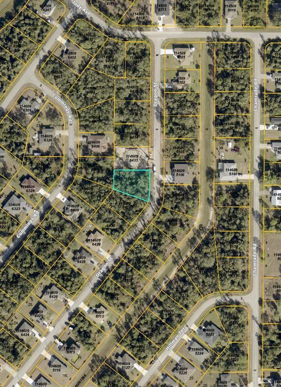 This is an aerial map showing a highlighted vacant lot located on a residential street — 00 DRAGON STREET, NORTH PORT, FL