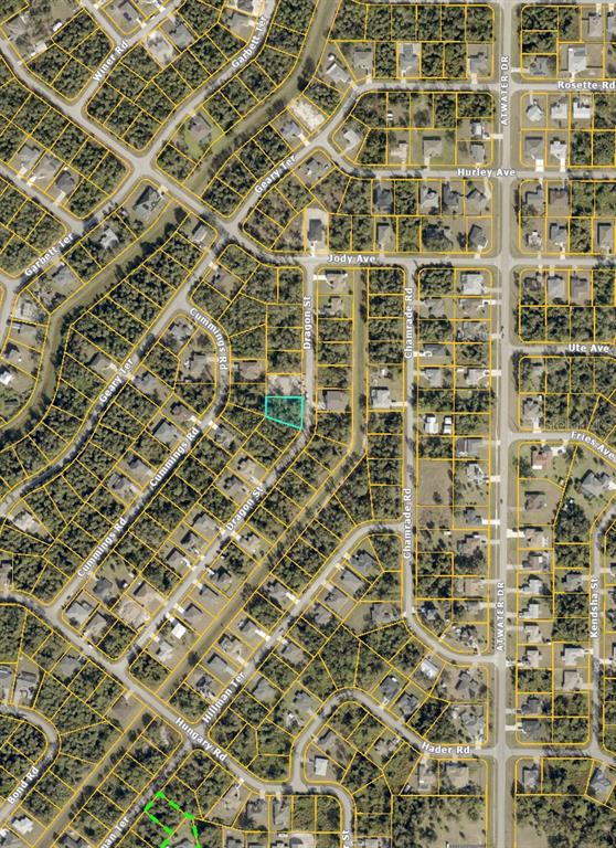 This is an aerial map showing a vacant lot highlighted in blue within a residential neighborhood — 00 DRAGON STREET, NORTH PORT, FL