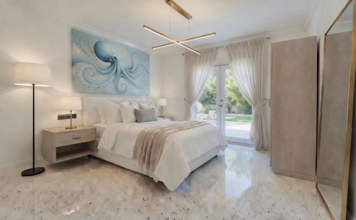 A bedroom features a large octopus painting above the bed, light wood furniture, and tile floors — 250 NE 13th Street, Delray Beach FL 33444, DELRAY BEACH, FL