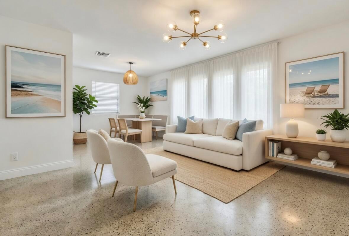 A bright living and dining area features a white sofa, two armchairs, and polished floors — 250 NE 13th Street, Delray Beach FL 33444, DELRAY BEACH, FL