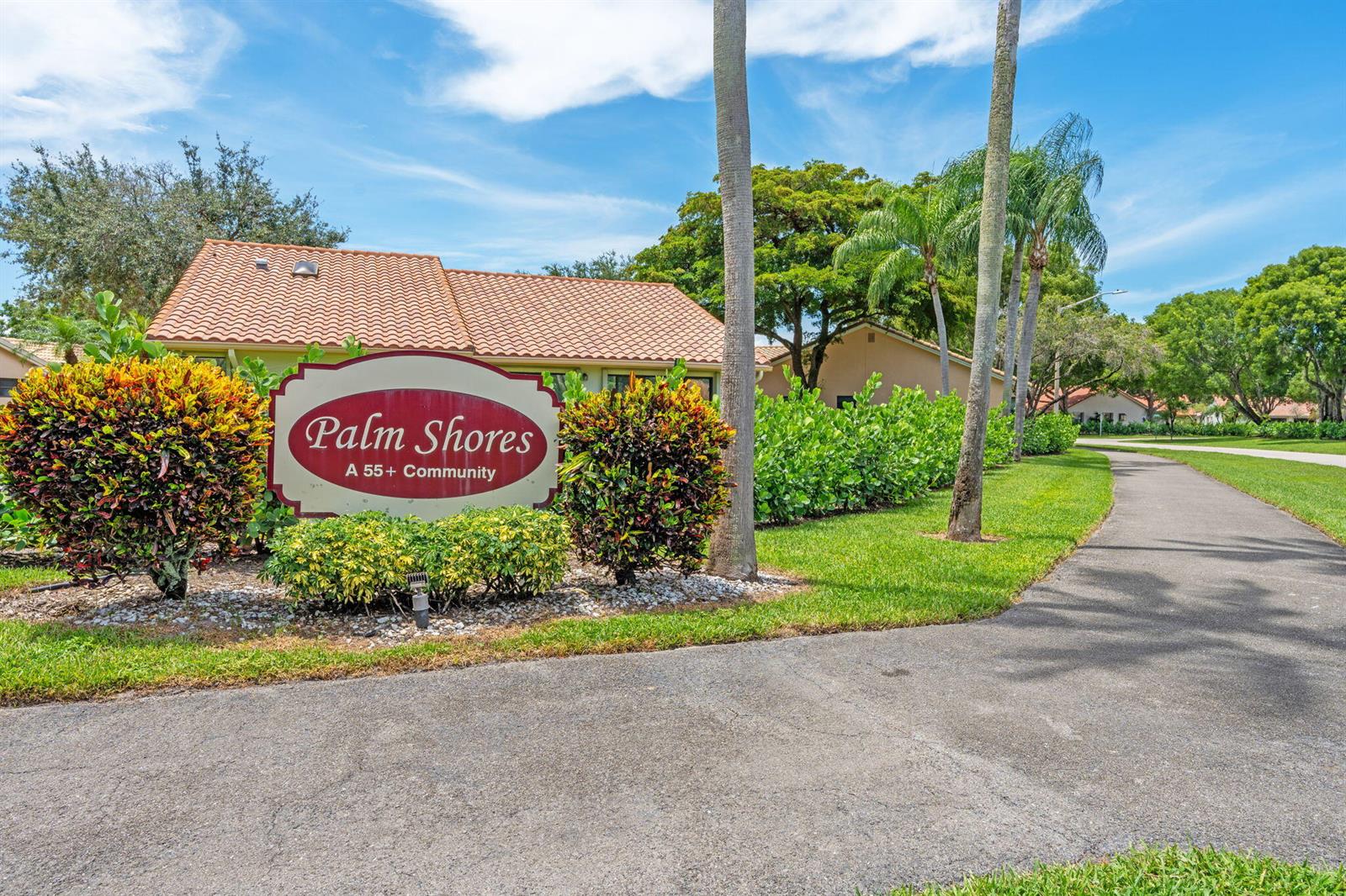 A sign for a 55+ community stands in front of a house with a tiled roof — 4520 Catamaran Circle, Boynton Beach FL 33436, BOYNTON BEACH, FL