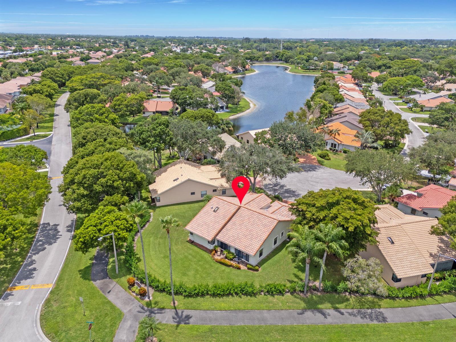 An aerial view shows a residential house with a tiled roof and a red location pin — 4520 Catamaran Circle, Boynton Beach FL 33436, BOYNTON BEACH, FL